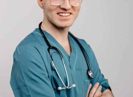 Smiling Doctor in Scrubs