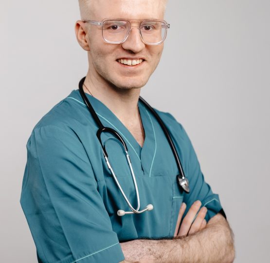 Smiling Doctor in Scrubs